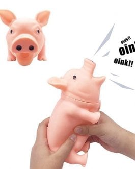 A pig toy shouts at a click to play for a dog