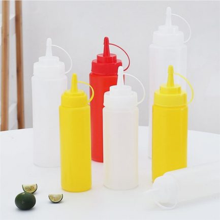 Squeeze squirt condiment, ketchup mustard  mayo sauces  olive oil, bottles with twist on cap